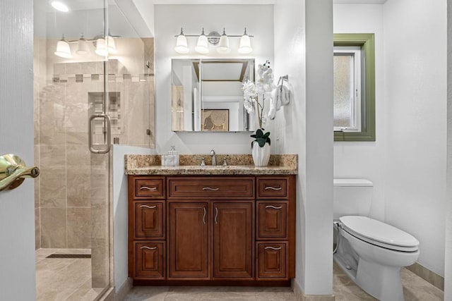 bathroom with vanity, toilet, and walk in shower