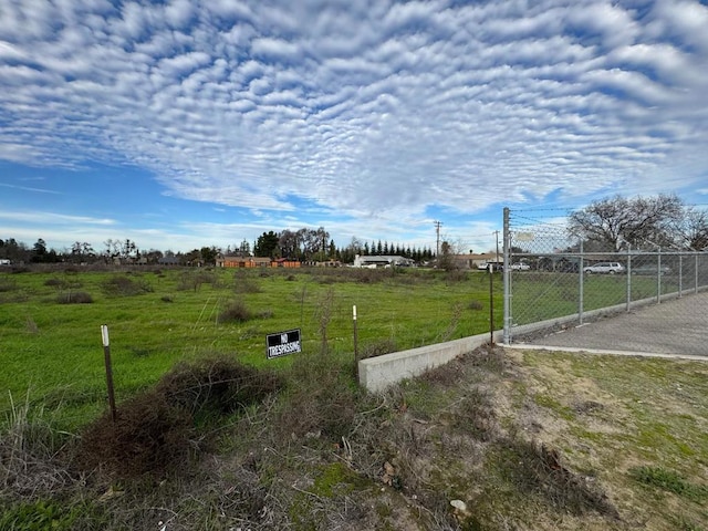 view of yard with a rural view