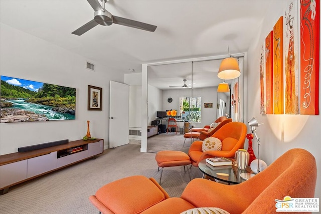 living room featuring ceiling fan and light carpet