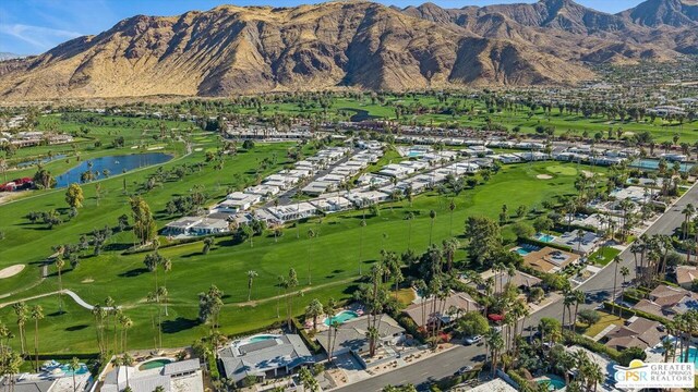 birds eye view of property featuring a water and mountain view