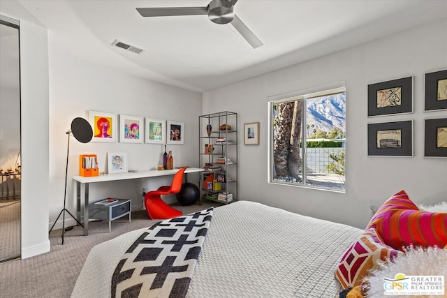 bedroom with ceiling fan and carpet flooring