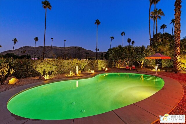 view of pool with a mountain view