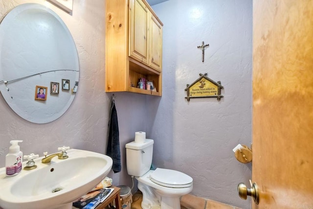 bathroom with sink and toilet