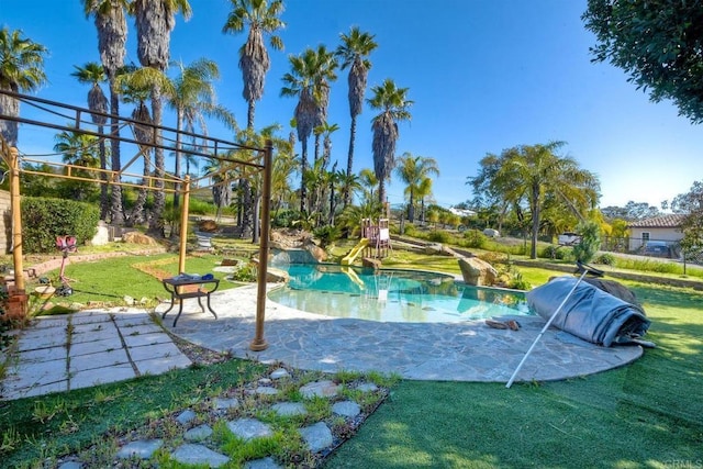 view of swimming pool with a patio