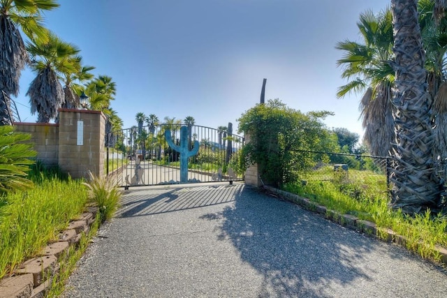 view of gate with fence