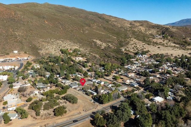 birds eye view of property featuring a mountain view