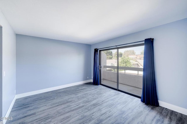 spare room featuring dark hardwood / wood-style flooring