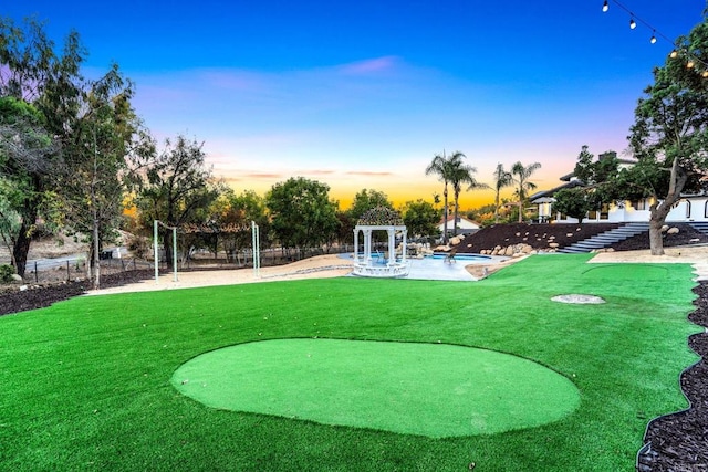 view of property's community featuring a patio, a swimming pool, and a lawn