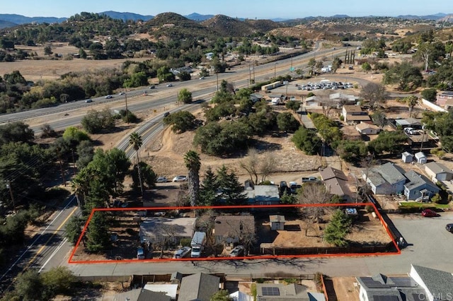 drone / aerial view with a residential view and a mountain view