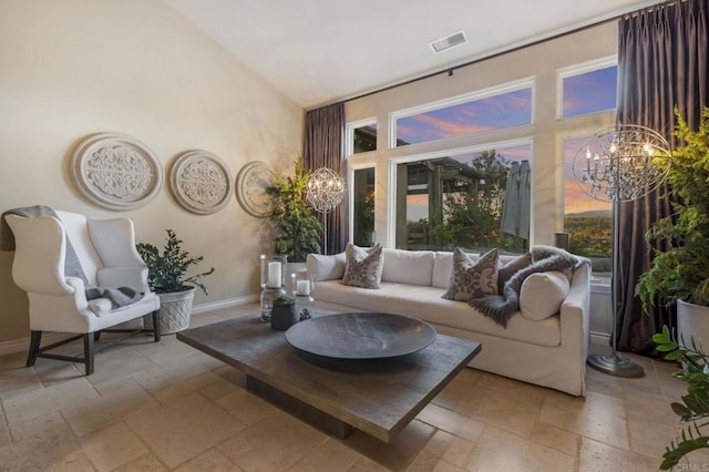 living room with a notable chandelier