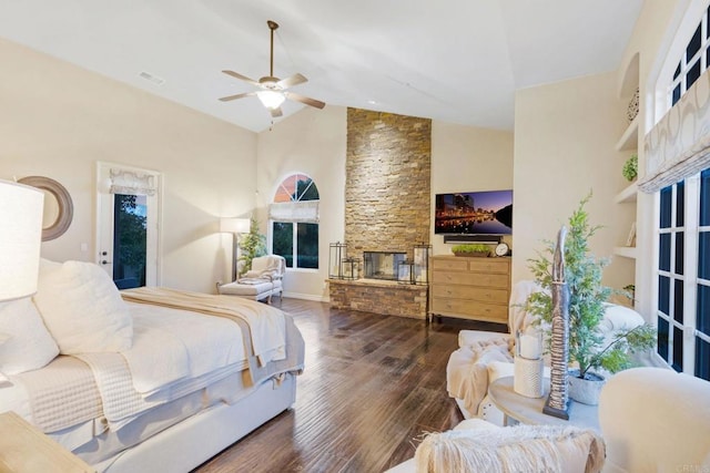 bedroom featuring dark wood-type flooring, a fireplace, high vaulted ceiling, access to outside, and ceiling fan