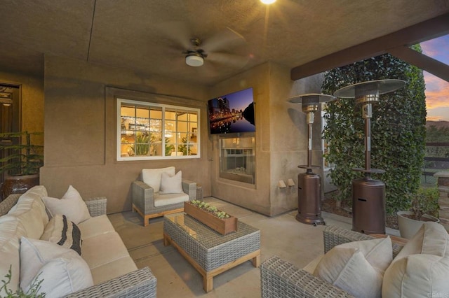 view of patio with ceiling fan and outdoor lounge area