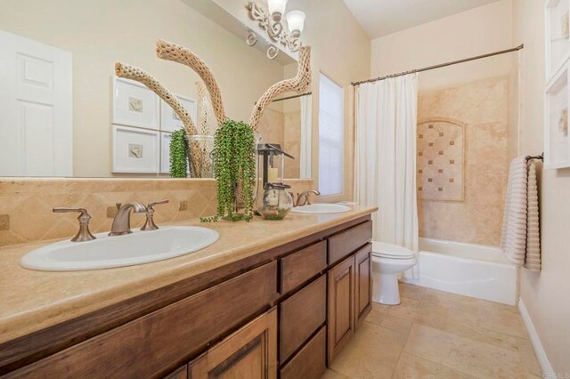 full bathroom with toilet, vanity, backsplash, and shower / tub combo with curtain