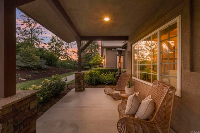 view of patio terrace at dusk