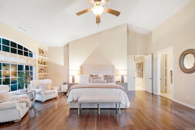 bedroom with ceiling fan, dark wood-type flooring, and lofted ceiling