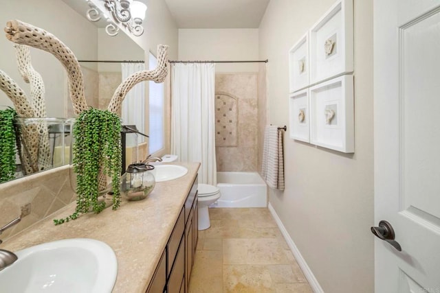 full bathroom featuring toilet, vanity, and shower / tub combo