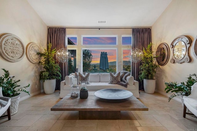 living room with a notable chandelier