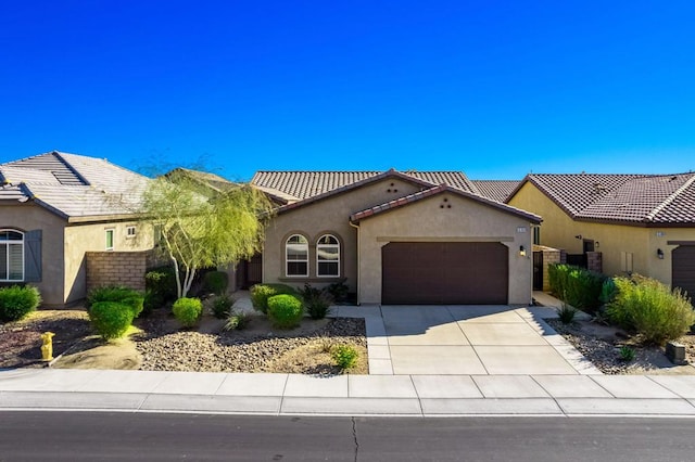 mediterranean / spanish-style home featuring a garage