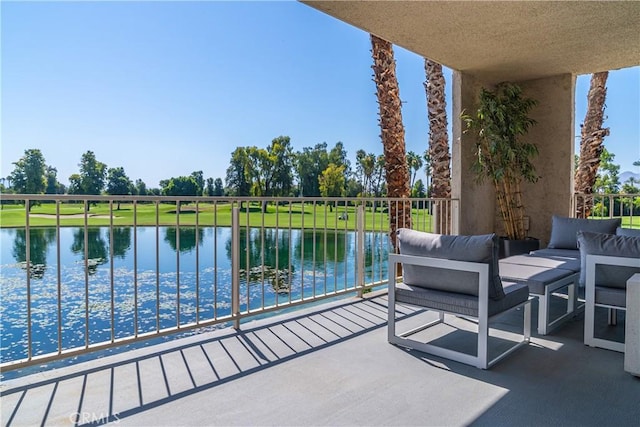 balcony featuring a water view