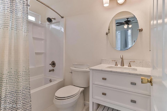 full bathroom featuring toilet, ceiling fan, vanity, and shower / bath combo with shower curtain