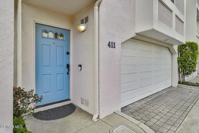 entrance to property with a garage