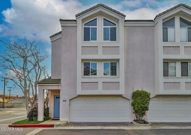 view of front of property featuring a garage