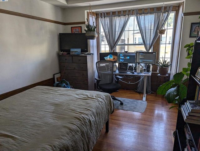 bedroom featuring hardwood / wood-style flooring