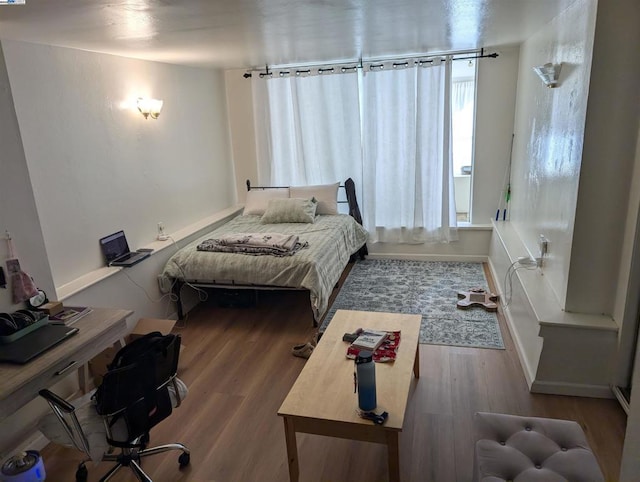 bedroom featuring hardwood / wood-style flooring