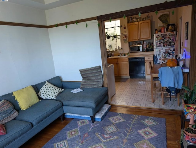 living room with sink and light hardwood / wood-style floors