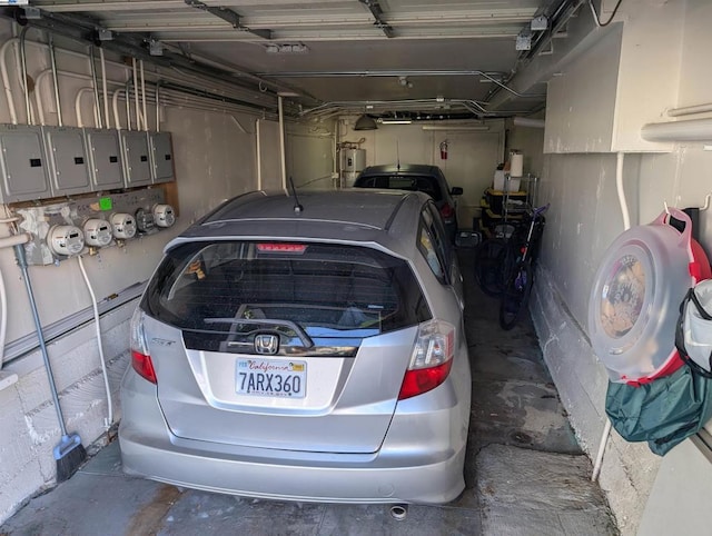 garage featuring water heater and electric panel