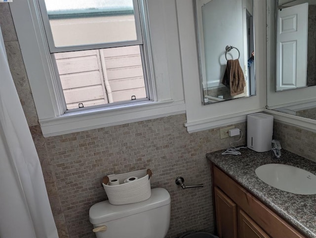 bathroom featuring toilet and vanity