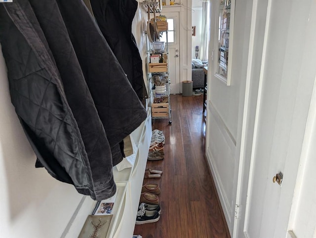 hall with dark wood-type flooring