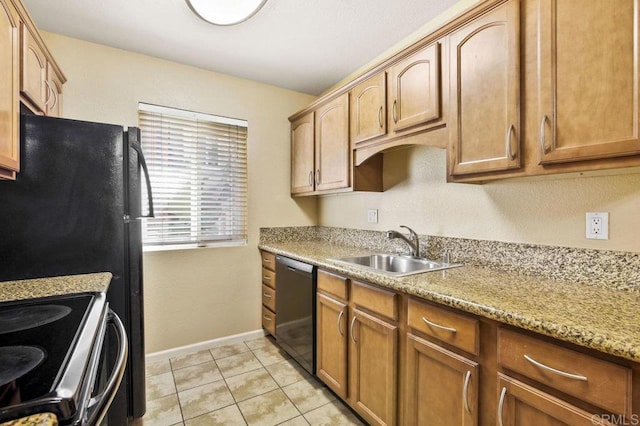 kitchen with light stone countertops, stainless steel dishwasher, sink, light tile patterned floors, and stove