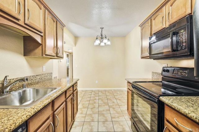 kitchen featuring pendant lighting, black appliances, sink, a notable chandelier, and light tile patterned floors