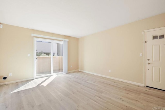 unfurnished room with light hardwood / wood-style flooring