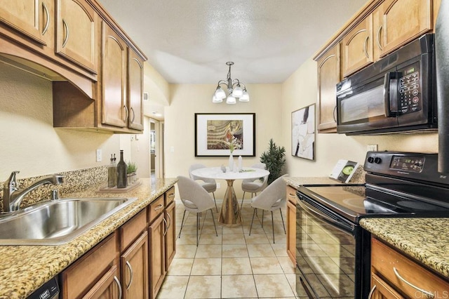 kitchen featuring light tile patterned flooring, hanging light fixtures, a chandelier, black appliances, and sink