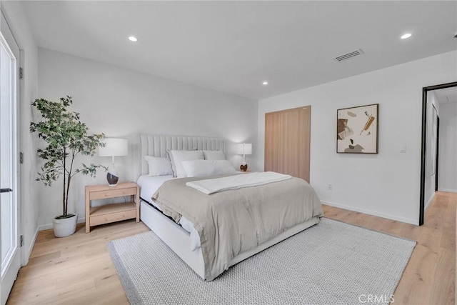 bedroom featuring light wood-type flooring