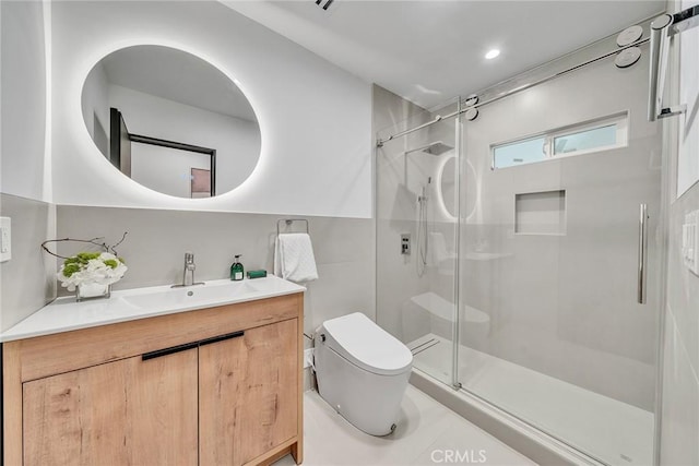 bathroom with vanity, toilet, tile patterned floors, and an enclosed shower