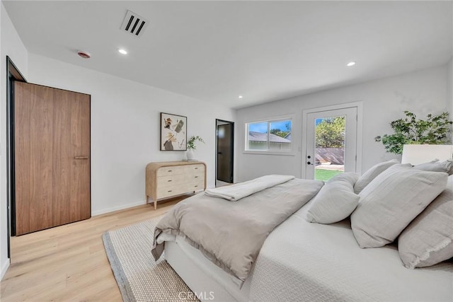 bedroom featuring access to outside and light hardwood / wood-style flooring