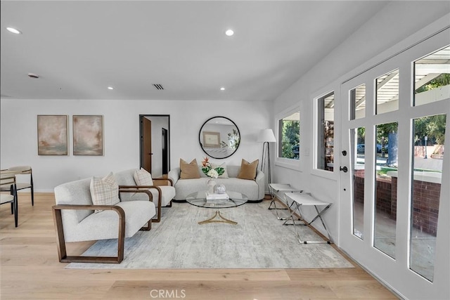 living room with light hardwood / wood-style flooring