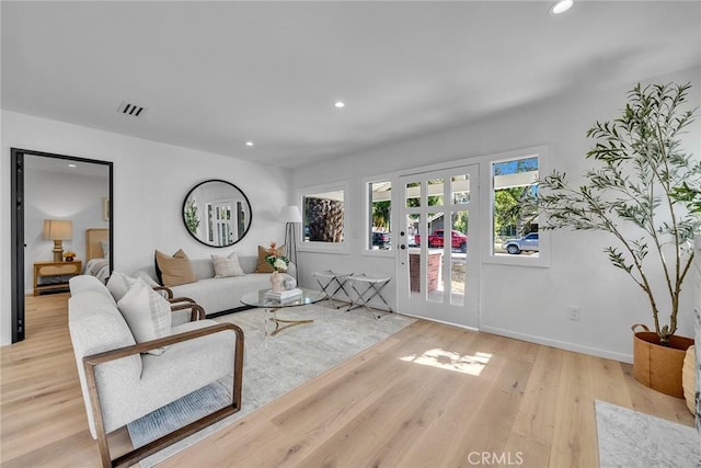 living room with light hardwood / wood-style flooring