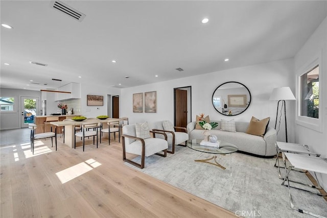 living room with light hardwood / wood-style flooring