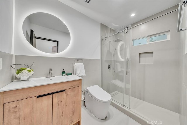 bathroom with an enclosed shower, vanity, and toilet