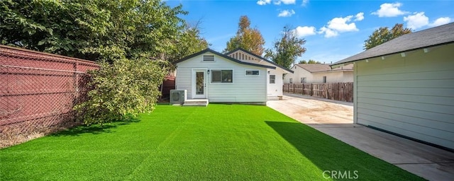 back of property featuring a patio area and a lawn