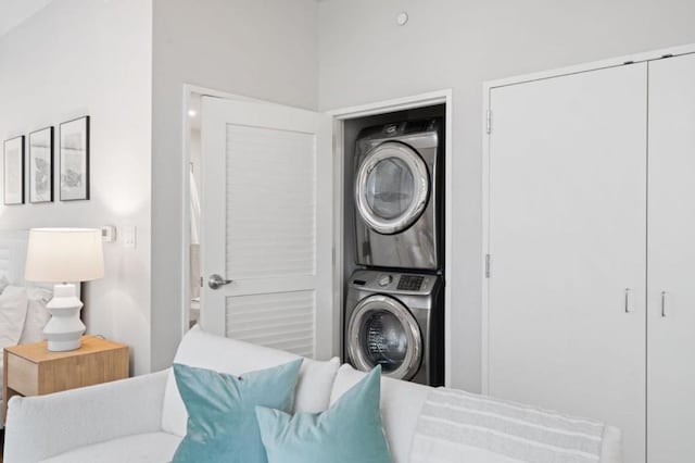 washroom featuring stacked washing maching and dryer