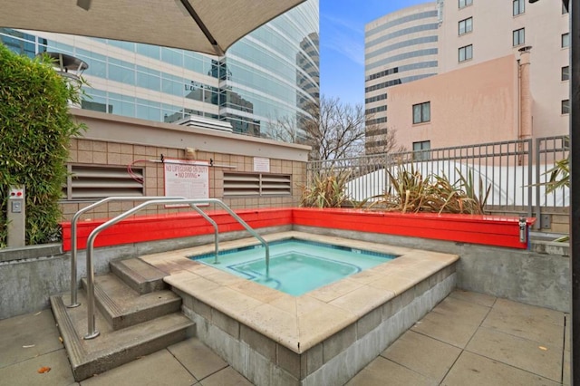 view of swimming pool featuring a community hot tub