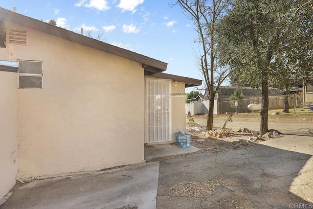 view of side of home with a patio area