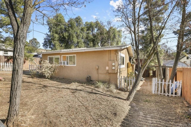 view of side of property with cooling unit