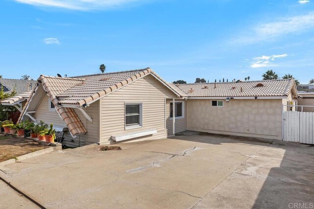 back of house with a patio