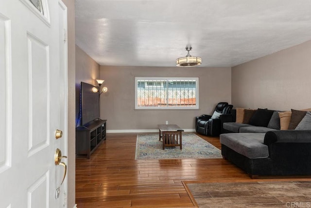 living room featuring dark hardwood / wood-style floors